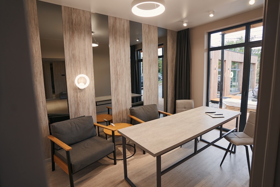 Meeting room with wooden table and armchairs