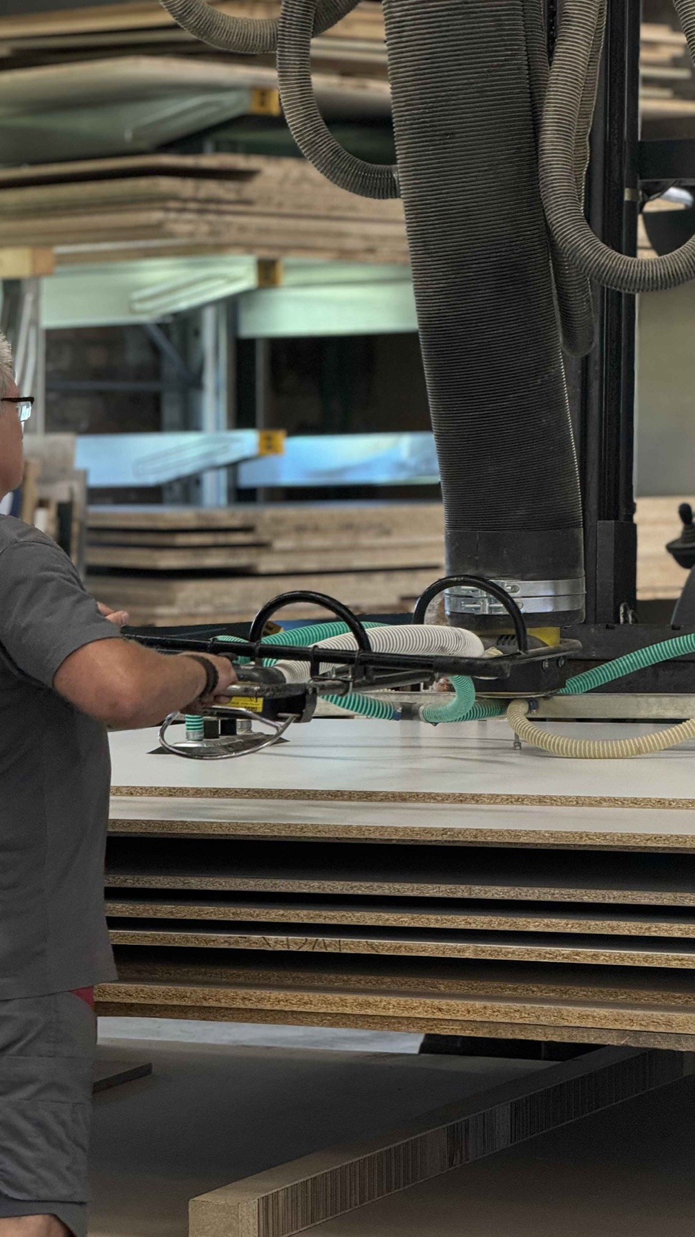 CNC machine processing a wood panel at Spals factory