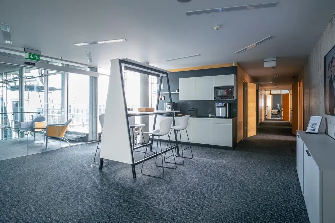 Office kitchenette with a freestanding bar table