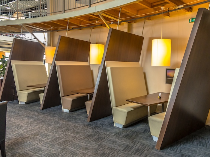 Restaurant booths with high wooden partitions