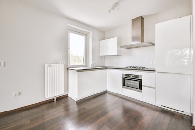 White fitted kitchen in a bright apartment