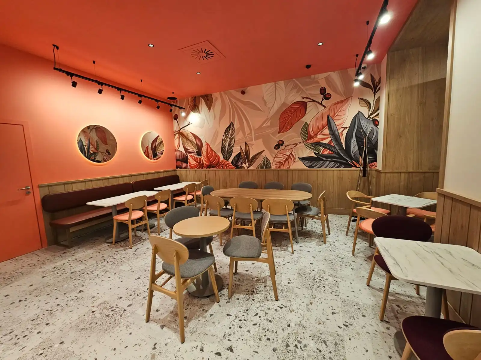 Restaurant interior with oak chairs, tables and wall panelling