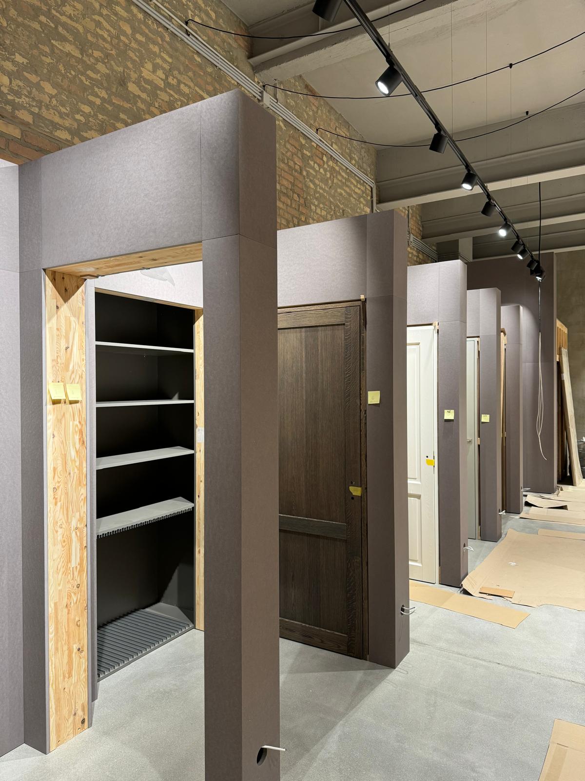 Built-in wardrobes with dark doors in a hotel corridor
